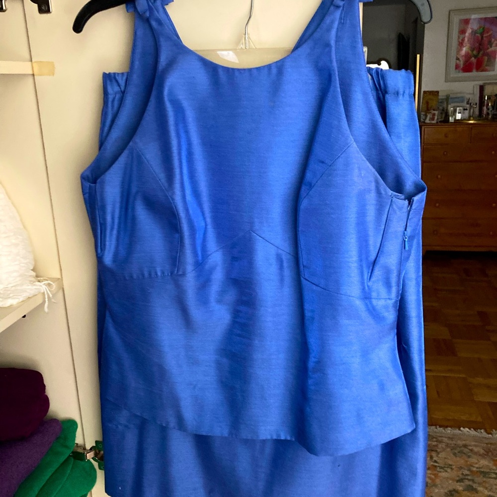 Sateen two piece, fully lined, detailing on back , fabric buttons. Elegant.